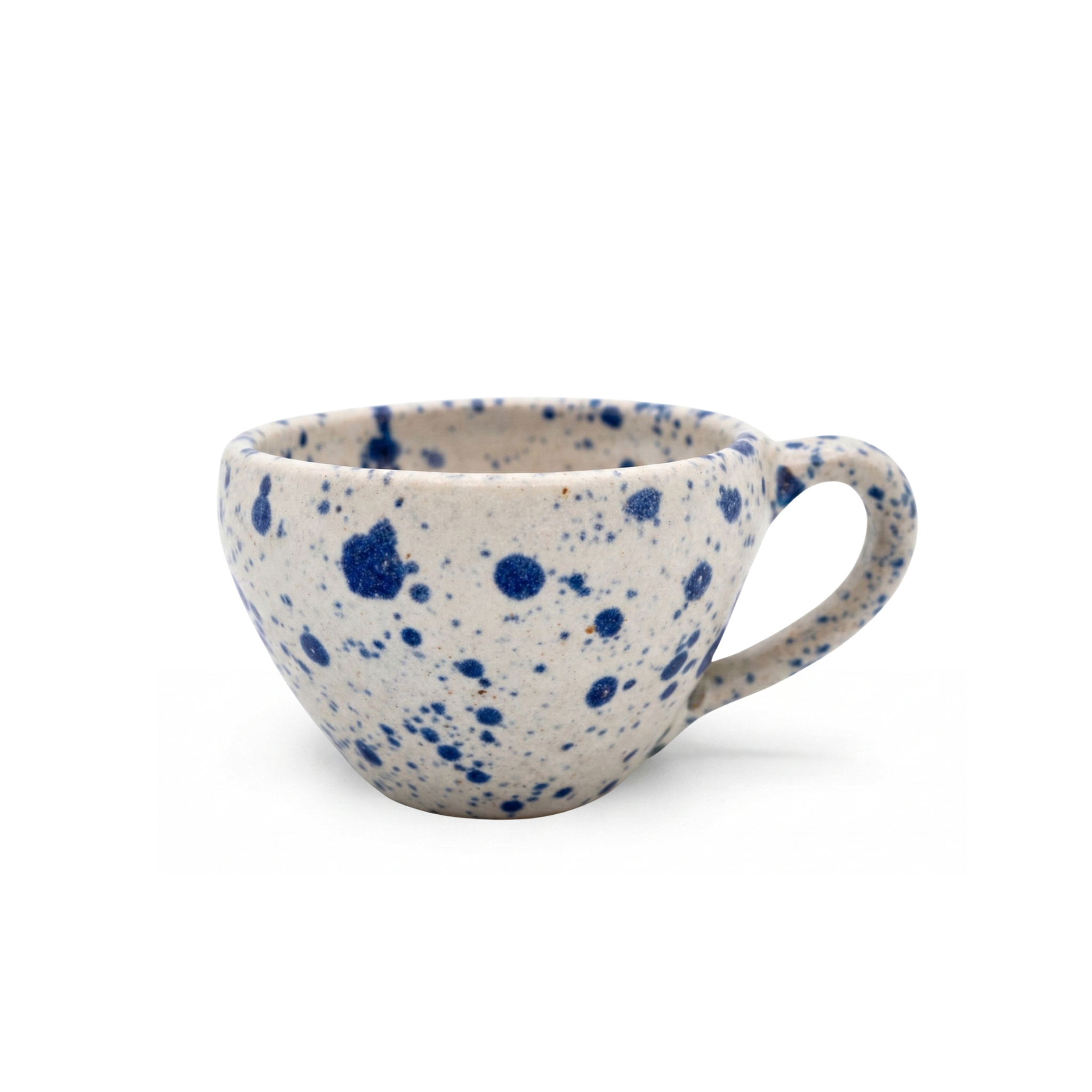 Handmade 12 oz ceramic mug featuring a rustic indigo blue speckled pattern, side profile view on white background.