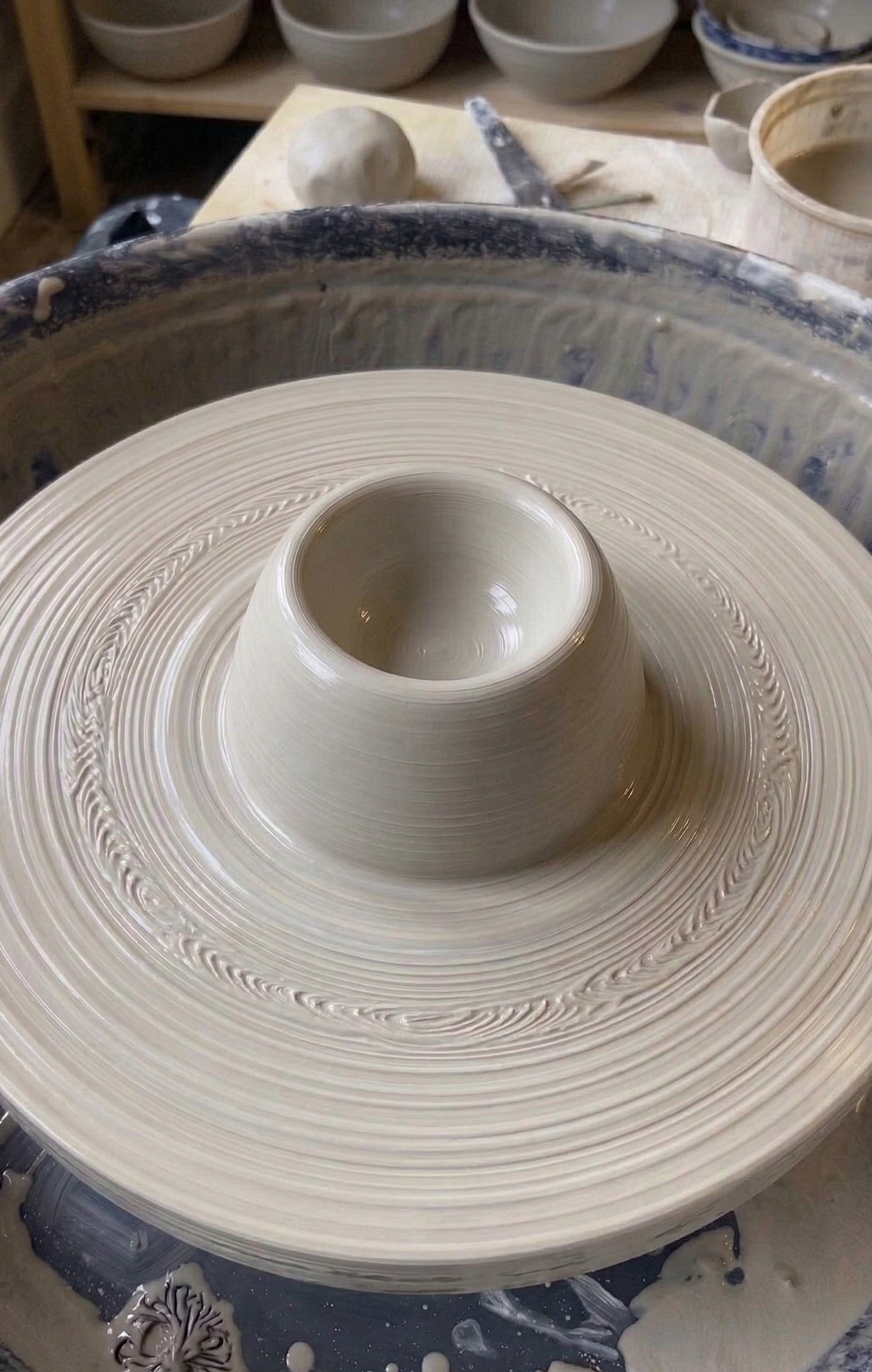 Ceramic mug on a potter's wheel